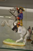 A porcelain model of Napoleon on horseback.