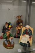 A Royal Doulton figure The Jester HN2016 together with the Balloon Man HN1954, The Wayfarer HN2362