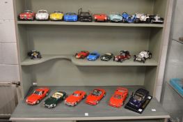 A good collection of Burago model cars together with a Schuco clockwork ferrari.