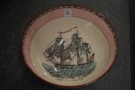 A large lustre ware bowl decorated with the ship Caroline and the Ship Wrights Arms.