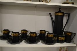 A Portmeirion coffee service, black ground with greek key decoration.
