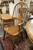 A Windsor style broad armchair.