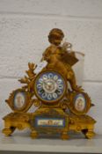 A French spelter mantel clock with porcelain panels.