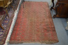 An old Bokhara carpet, worn 7' x 4' 1