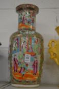 A Chinese famille rose vase (cracked).