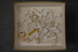 A large quantity of meerschaum pipes and pipe bowls.