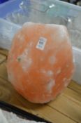 A large Himalayan rock salt lamp base.