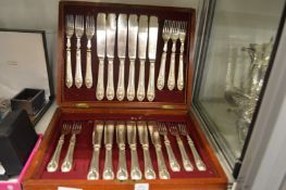 A cased set of twelve fish knives and forks (lacking one fork).