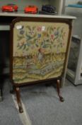 A folding fire screen/table.
