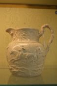 A moulded hunting jug.