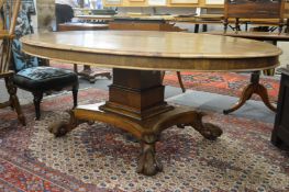 A good early 19th century rosewood oval centre or dining table on a square column support, the