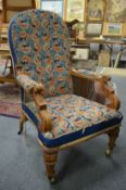 A 19th century walnut framed and tapestry upholstered open armchair.