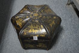 A chinoiserie decorated black lacquer hexagonal shaped box and cover.
