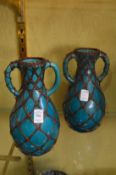 A pair of decorative vases.