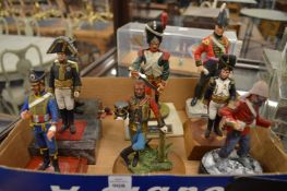 A group of eight military figures.