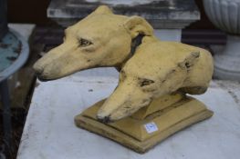 A garden sculpture modelled as a double dogs head.