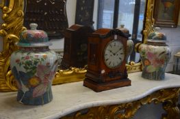 A pair of colourfully decorated Chinese temple jars and covers.