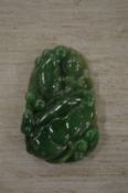 A Chinese carved jade amulet.