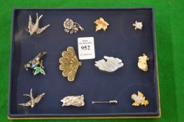 A collection of brooches.