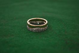 A 18 carat gold and diamond double hoop eternity ring.