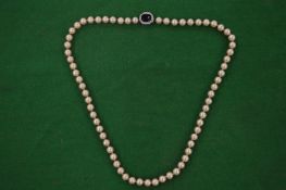 Decorative pearl necklace.
