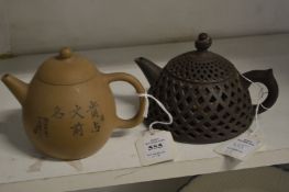Two Chinese Yixing teapots, one with reticulated body.