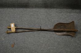 A pair of steel fire irons.