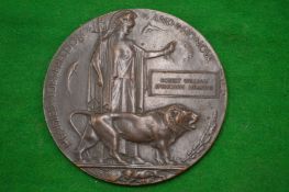 A WWI bronze death penny awarded to Robert William Spencarn Meakins.