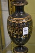 Gilt decorated pottery vase.