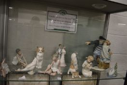 A large Nao group of a fisherman and a young girl together with Lladro and similar items.