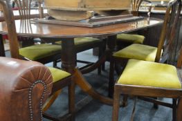 A Georgian style mahogany twin pillar extending dining table with one leaf.