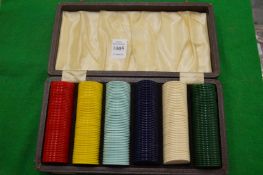 Cased set of gaming chips.