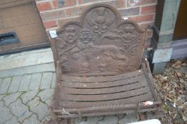 A cast iron fireback and grate.