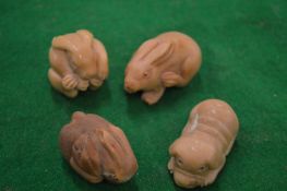 Four carved netsukes.