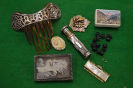 A silver mounted tortoiseshell hair slide and other items.