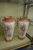 A large pair of decorative vases.