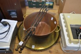 A brass tray, copper preserve pan and a set of three fireside tools.