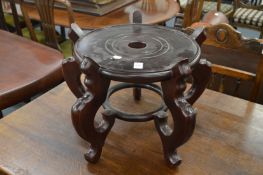 A Chinese urn stand.