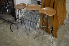 Three stylish beech and chrome bar stools.