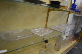 Four cut glass trays.