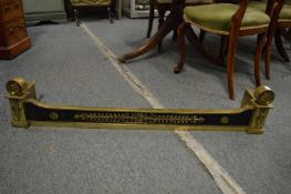A 19th century brass fender of Adam design with quivers and roundels 3' 10