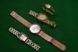 Four designer wrist watches by Michael Kors, Emporio Armani and Tommy Hilfiger.