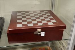 A Napoleonic chess set, unused, in original box.