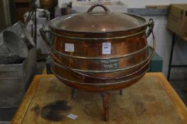 A heavy cast metal cauldron style cooking pot with lid, marked Falkirk size 5.