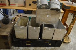 Galvanized storage cans and two old paint kettles.
