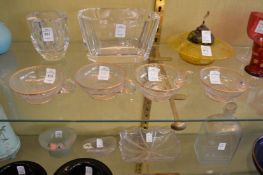 A set of four gilt decorated glass cups.