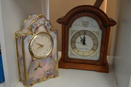 Two mantel clocks.