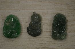 Three Chinese carved jade amulets.