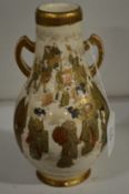 A satsuma twin handled bottle vase, base drilled.