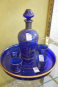 Blue glass liqueur set.